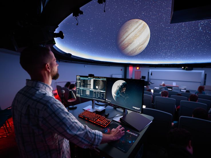 Inside the Cejka Planetarium during a show