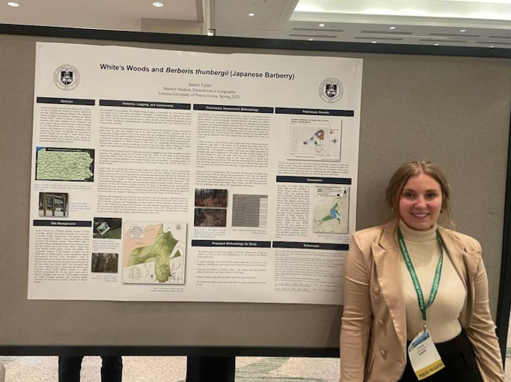 Joece Lynn in front of her research poster