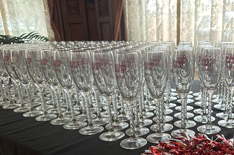 Champagne glasses lined up for commencement celebration toast