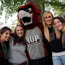 Norm with students at homecoming