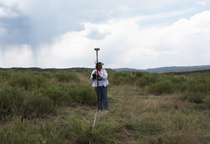 Graduate student Germaine McArdle uses Global Positioning System equipment at an archaeological site in New Mexico.