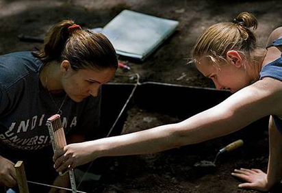 Brittany and Erica look for artifacts