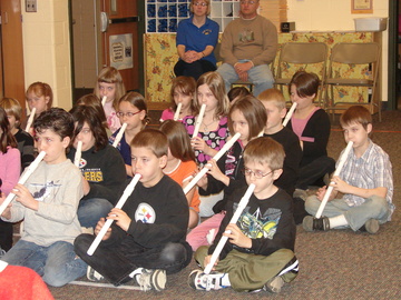 Apollo Ridge third and fouth graders playing homemade flutes