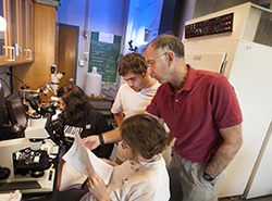 Dr. Simmons with students in lab