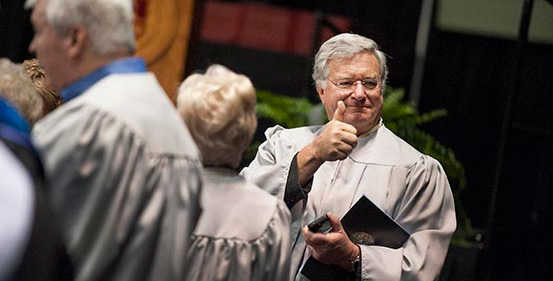 Award recipient giving a thumbs-up