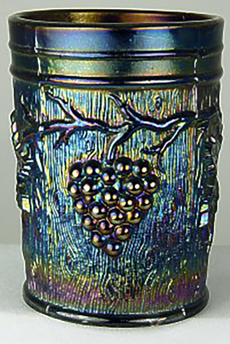 An example of a Carnival glass tumbler with grapevine.
