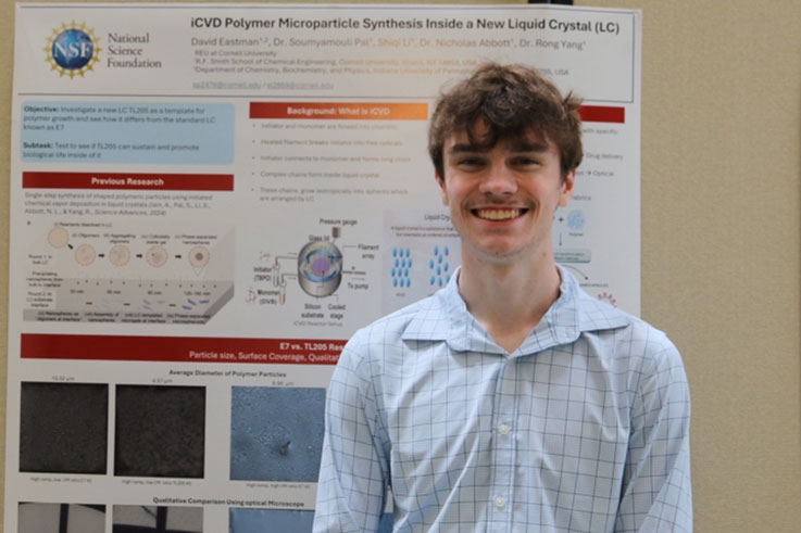 David Eastman with his research poster at Cornell University