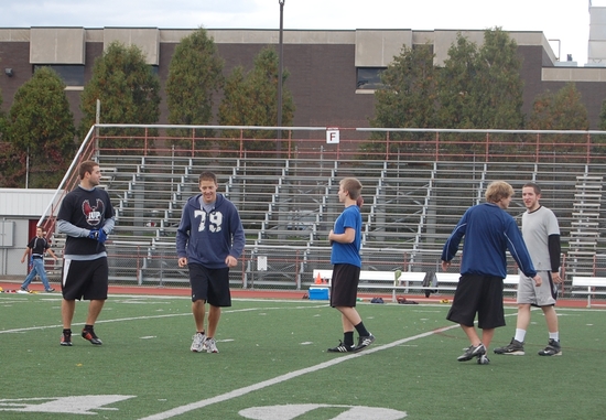 Students playing outside in the football stadium 