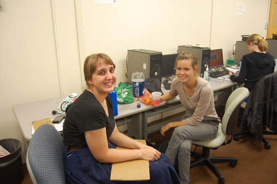 Students of the physics club pose for a photo while enjoying snacks 