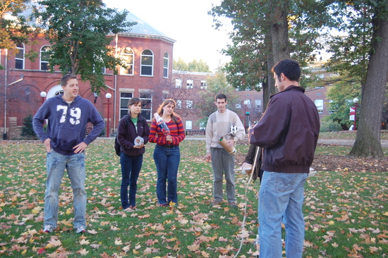 Students gather outside for a project 