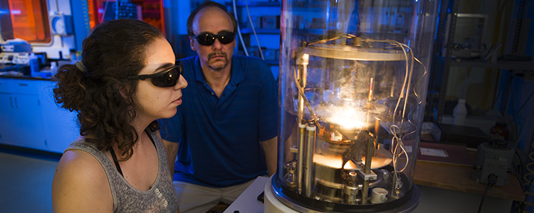 Physics Student and Professor in Lab Physics Student and Professor in Lab