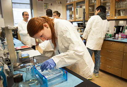 Students in a lab with a professor