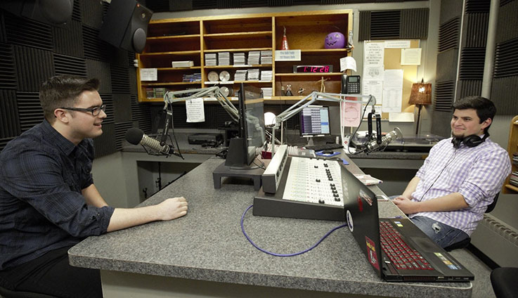 Two students in audio production studio