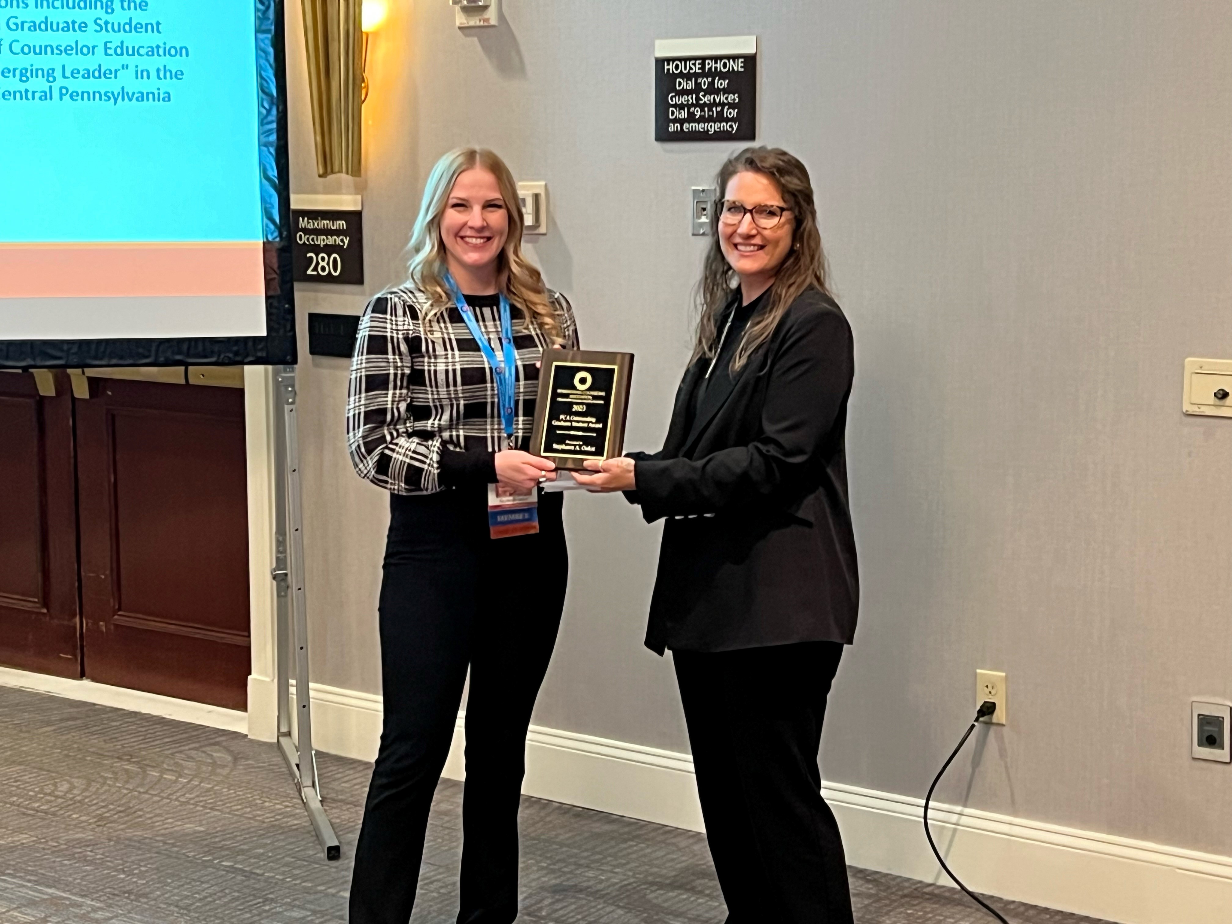 Stephanie Onkst being presented with the 2023 Pennsylvania Counseling Outstanding Graduate Student Award