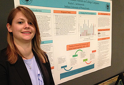 Kayla Jachimowski by her research poster