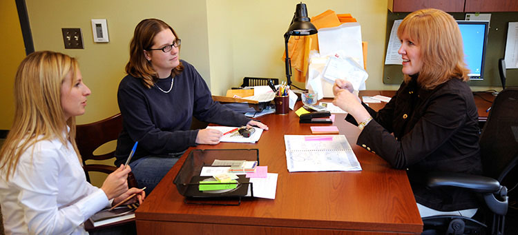 Professor Jennifer Roberts advises doctoral students on their research studies