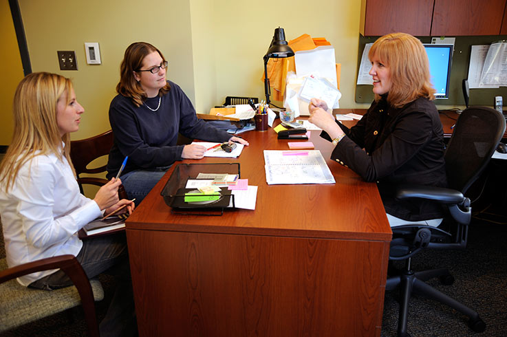 Students talk with a Criminology professor