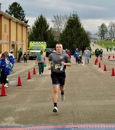 Cadet running in the Semper Gratus 5K
