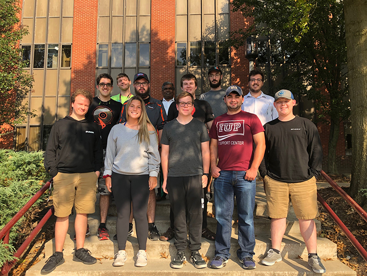 Students Douglas Cole, Chase Geis, Josh Griffith, Kaishia Ieraci, David Kornish, Brooklyn Kotula, James Lutz, Franklin May, Victor Sansing, Daniel Saylor, Duncan Taylor, and Tim Valentine who were on the team