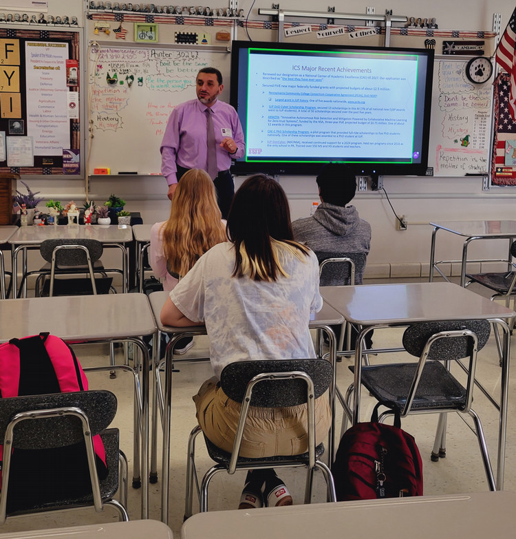 Farag presenting to students at Homer Center HS