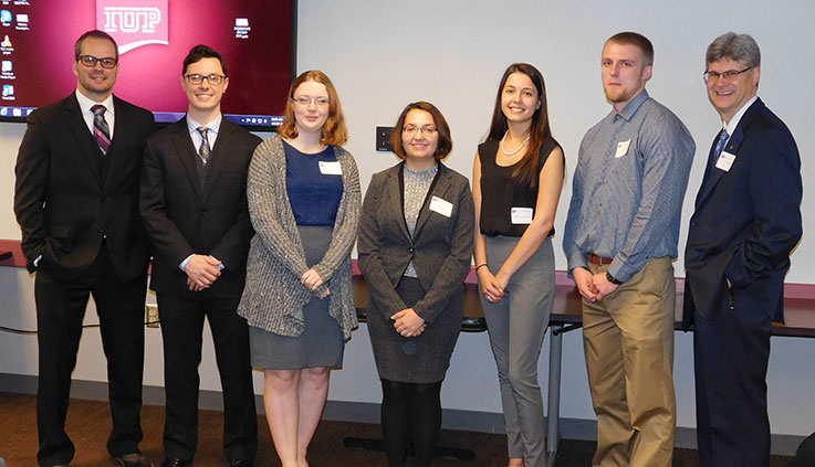 As an economics major, you can present research at the annual IUP Undergraduate Scholars Forum, as these students did. Jordan Gwinn and Robert Schwartz (first and second from left) then presented and won an award for their research at the Pennsylvania Economic Association annual conference.