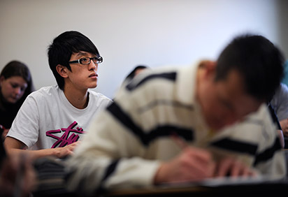 Student listening to lecture in classroom