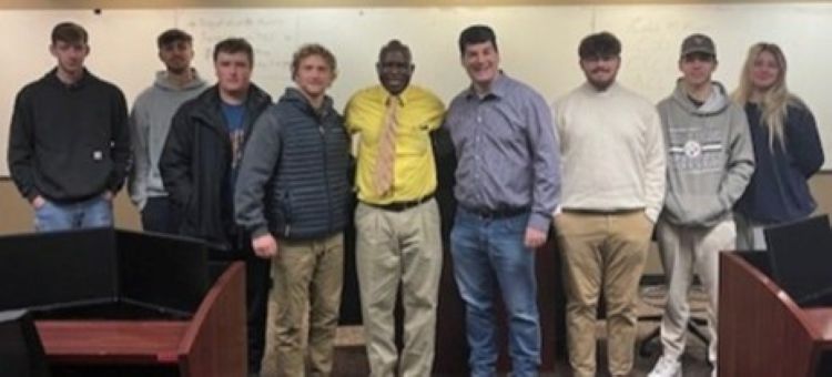 FIN 410 students with alumni speaker Caleb Moore