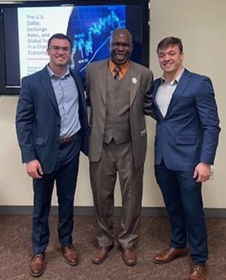 International Finance podium presenters and faculty mentor (l to r):  Aaron Burkhart, Dr. Yaya Sissoko, and Dylan McAnulty