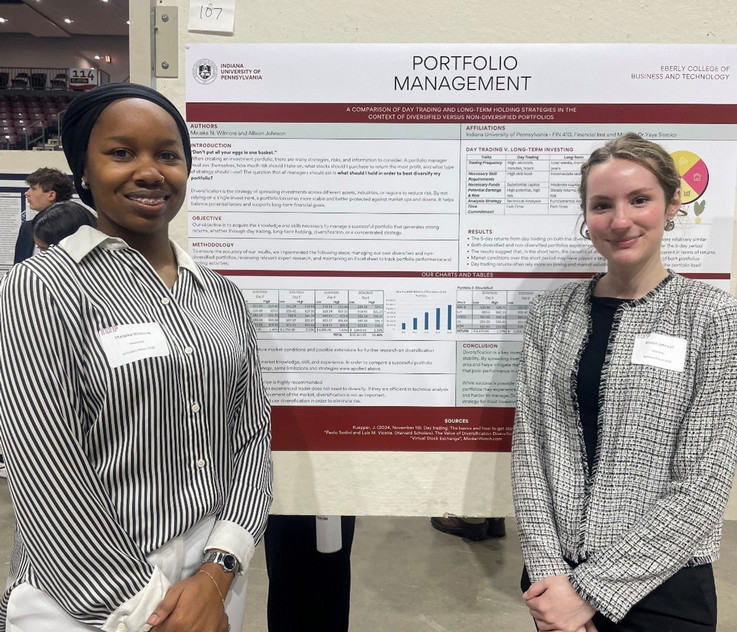 Financial Institutions & Markets student poster presenters (l to r):  Malaika Wilmore and Allison Johnson