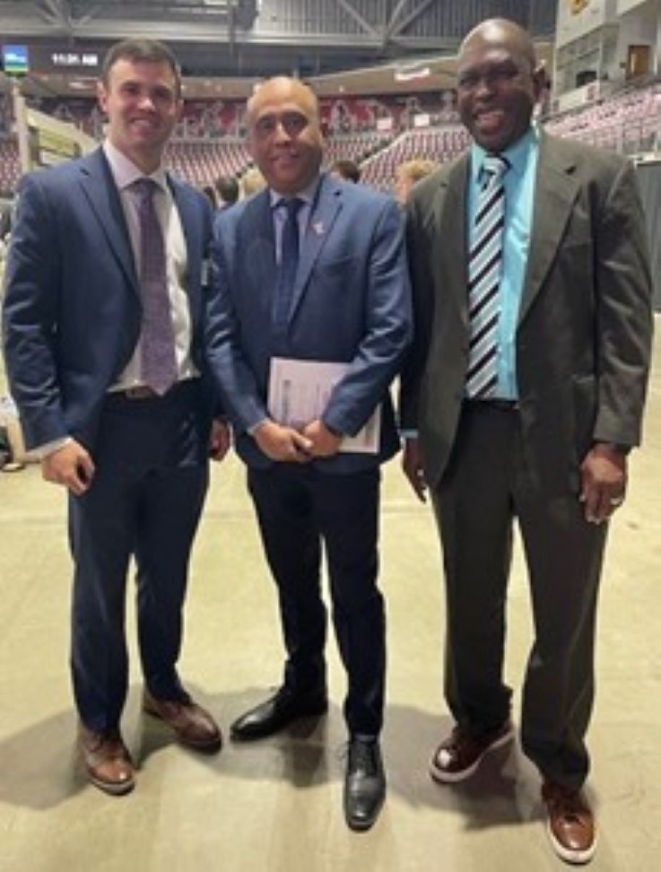 Aaron Burkhart, Eberly College of Business Dean Prashanth Bharadwaj, and IUP faculty mentor Yaya Sissoko