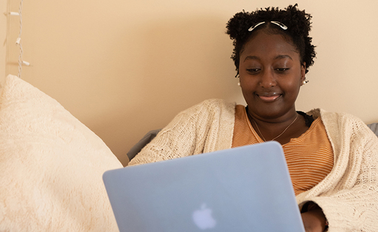 A student working on her laptop