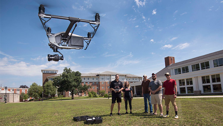 Students piloting a drone 