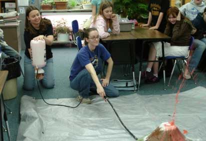 Students in the Earth and Space Science Education program teaching children about volcanoes
