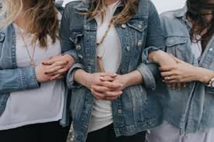 image of 3 women wearing denim jackets 