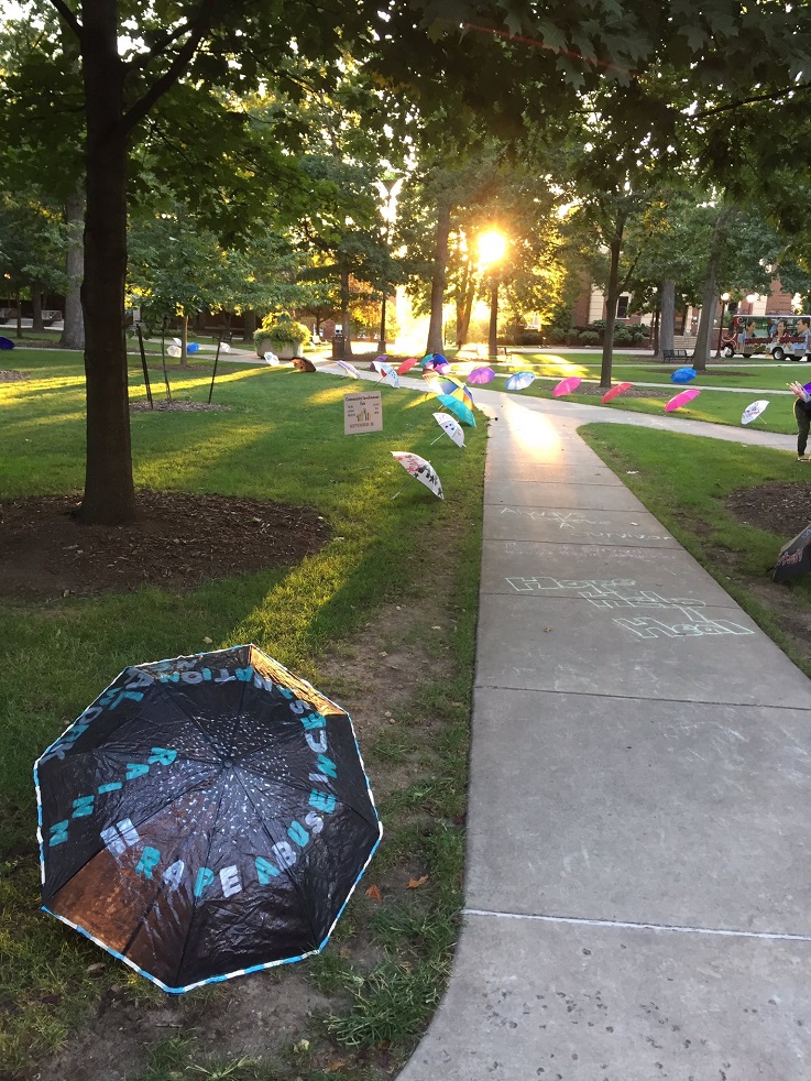 image from a past rainn day with umbrellas and chalking