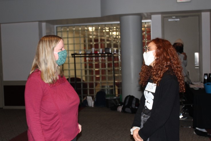 Adrianna converses with former supervisor Jennifer McCroskey.