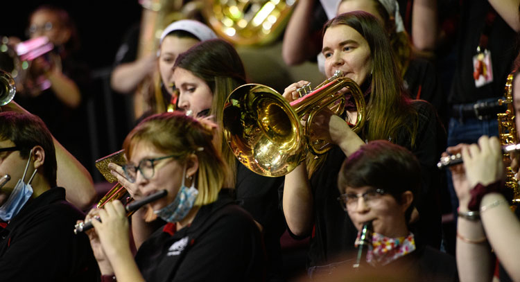 Close up of members of the Pep Band during a performance
