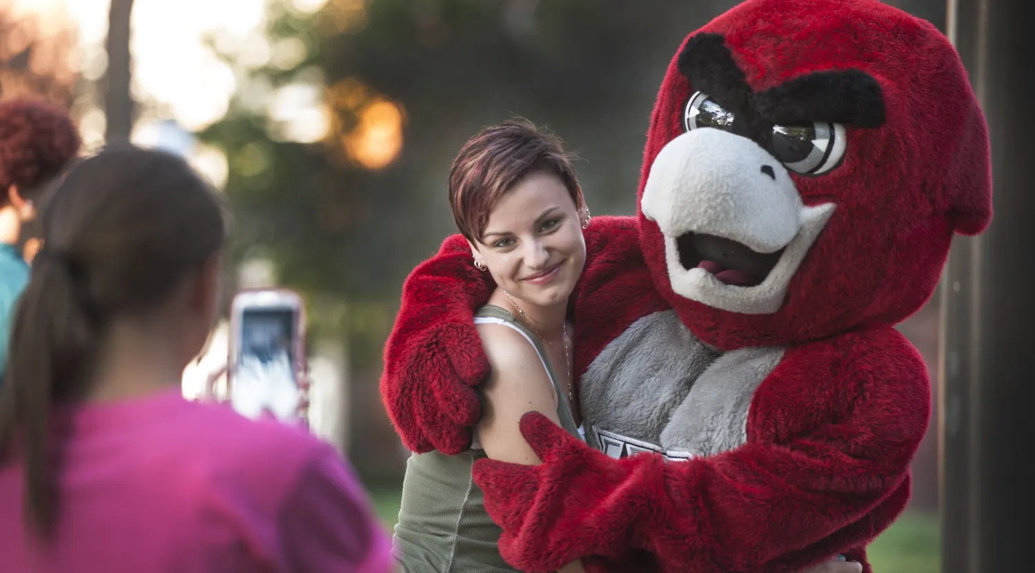 Norm posing for a photo