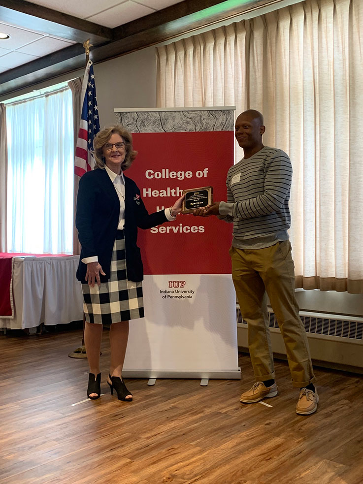 Charles Coleman receiving the 2021–22 Outstanding Efforts at Diversity, Equity, and Inclusion Undergraduate Student Award