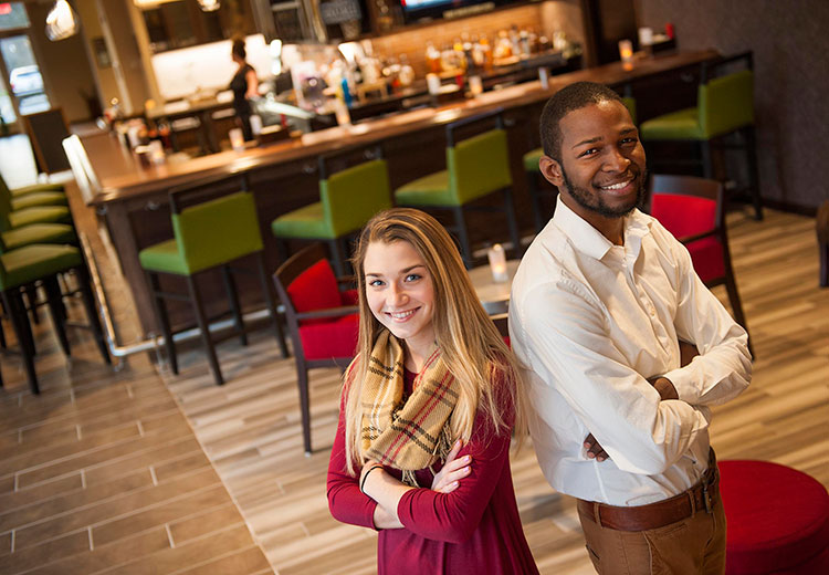 Two students smiling during their field experience opportunity