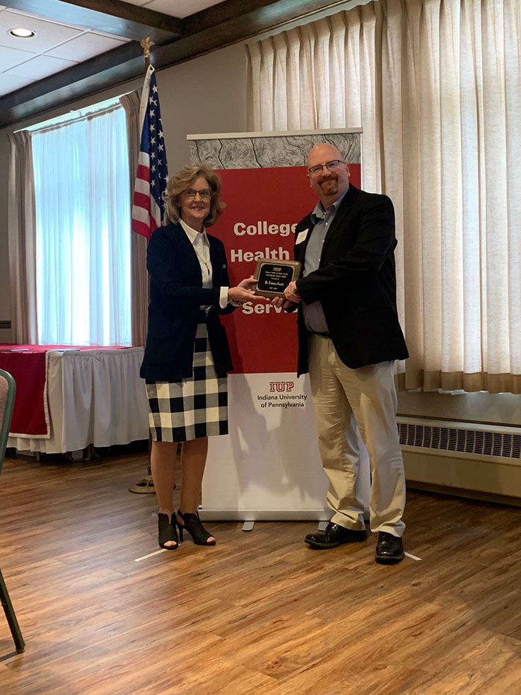 Joshua Castle receiving the 2021–22 Outstanding Service Award