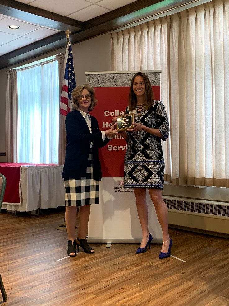 Tara Johnson receiving the 2021–22 Outstanding Teacher Award