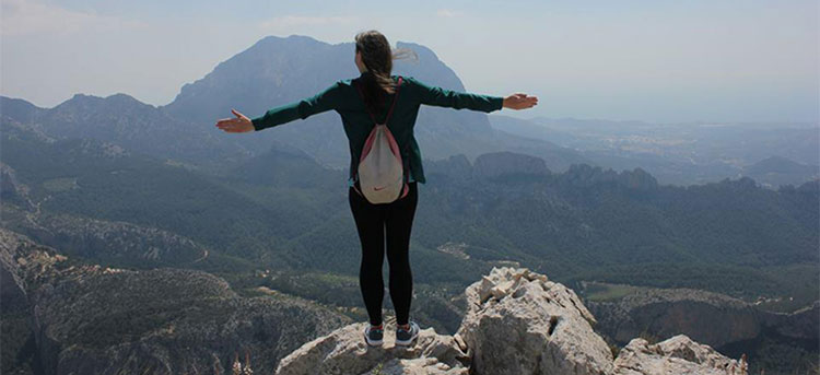 Student on mountaintop