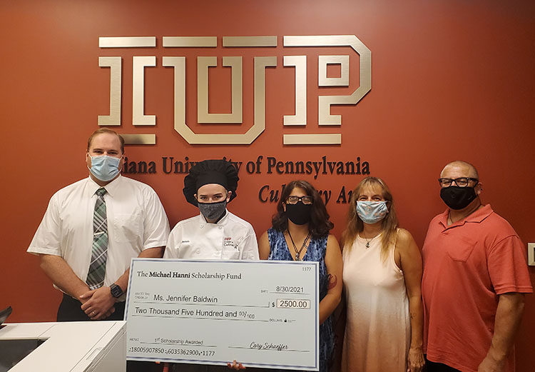 From left: Cory Schaeffer, former classmate and friend of Michael; Jennifer Baldwin, scholarship recipient; Sophia Hanni, Michael's sister; and Becky and John Hanni, Michael's parents