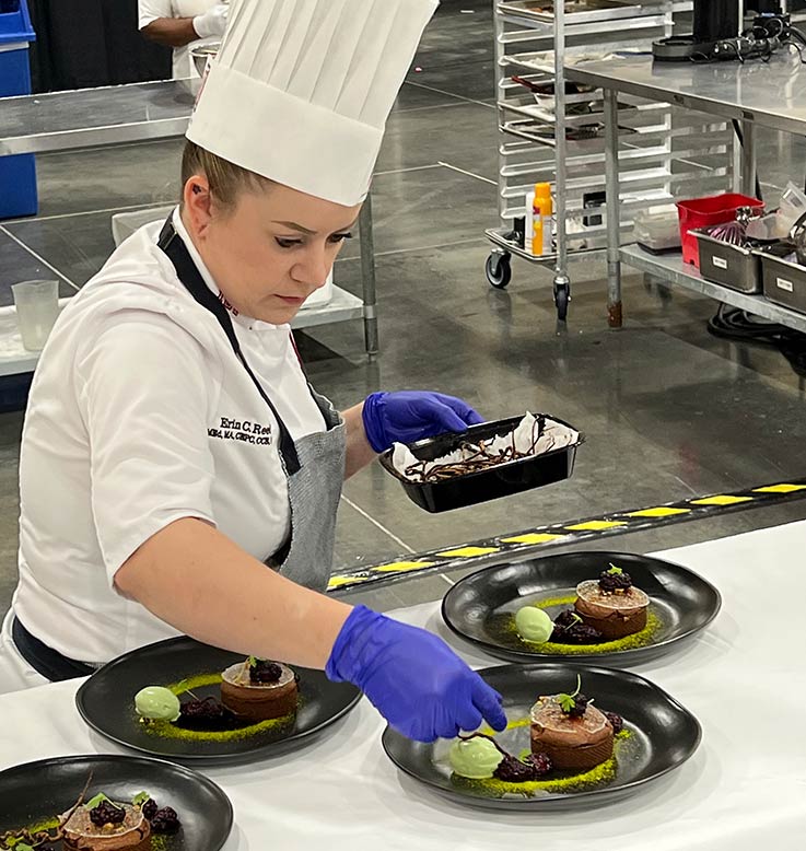 chef Reed plating a chocolate dessert