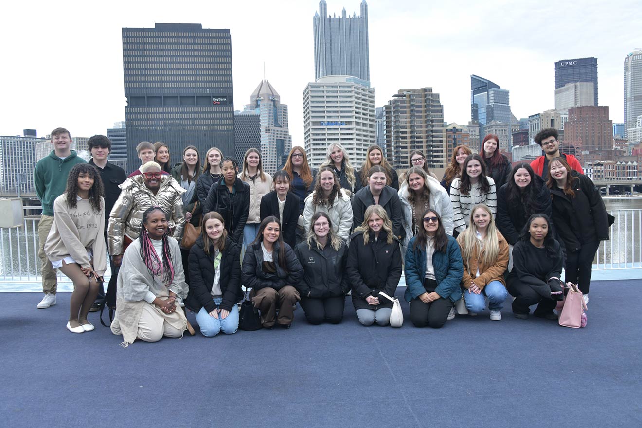 Group photo of students on top of the Gateway Clipper in Pittsburgh 
