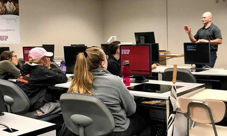 Corey Crocco talking to the class