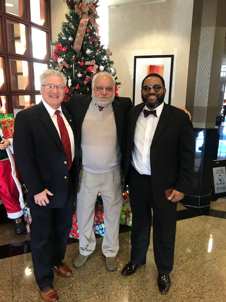 Stephen Shiring standing with two representatives of the Ivy Tech Accreditation Program