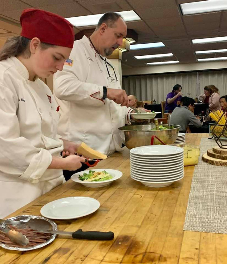 Students preparing Surf and Turf dinner