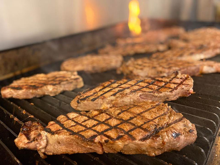 Strip steaks cooking